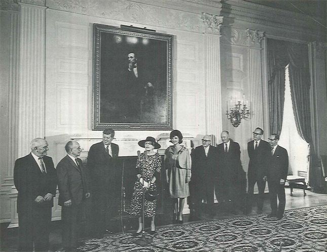 at far left, the two marble setters responsible meet with President John F. Kennedy, Alice Roosevelt Longworth, the First Lady Jackie, Johnny Powers, rep. of the Marble Setters and Carvers Union, and reps of the Marble Industry of New York. At far right, Mr Malcolm Cohen, now 98, also served as MIA President 1984-5.