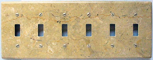 Custom Travertine and granite switch plates from Columbia Gorge Stoneworks. One of their special innovations are industrial magnet–backed plates that eliminate the need for drilling holes in the stone- decreasing risk of splitting or chipping their customer-supplied, very thin stone – and also giving customers the choice of a smoother plate with no screws.