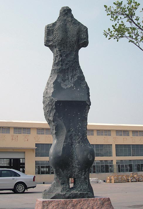 This dark, blue-green granite sculpture named “Etruscan Maenad” is 9 feet tall and stands in Hui’an county, China. According to Jon the material is fine grain and commonly used for figurative works in China but knows of no name. “It is fairly hard and weather resistant,” Jon says adding, that  the technique used to make it was to drill and use small wedges to break off the parts, and polish certain areas, with no chisel carving.