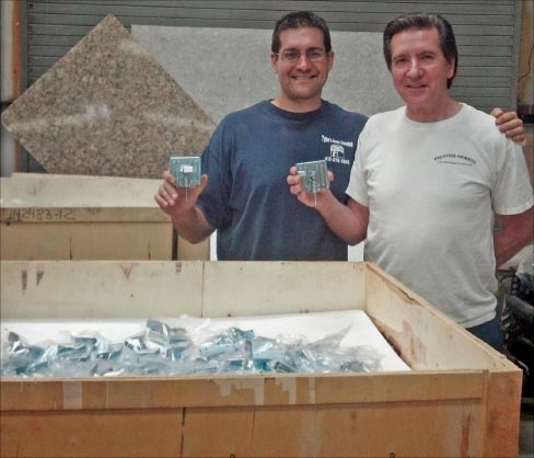 Matthew and August Iocco with a crate full of Super Fast Sink Brackets