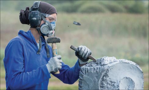 Miss Glenn Swanson carving her way into Viles Arboretum and Maine history.