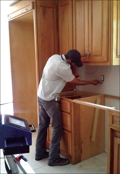 Measuring points for a backsplash can include the cutout for an electrical plate.