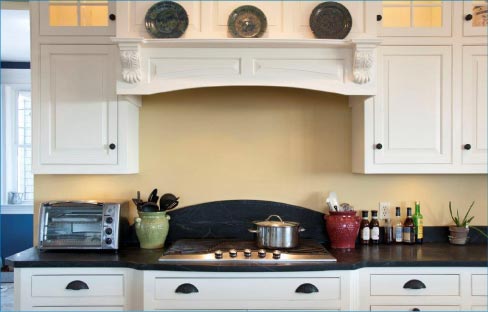 This beautiful Soapstone kitchen features an arched backsplash.