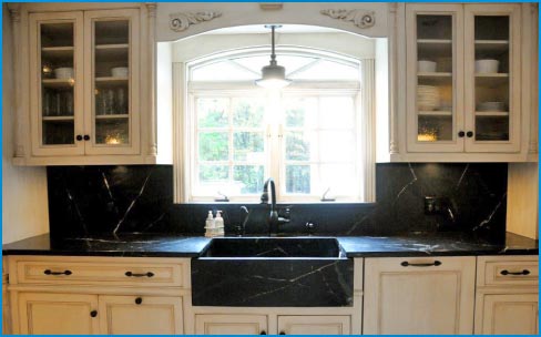 Detail view shows the soapstone countertops and the custom slant front sink.