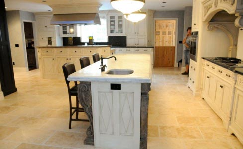 This charming Sturbridge home features a Bianco Carrara island with Brazilian Soapstone surround.