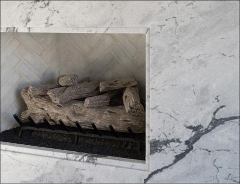 Transitional-style fireplace showcases Pearl Grey Marble