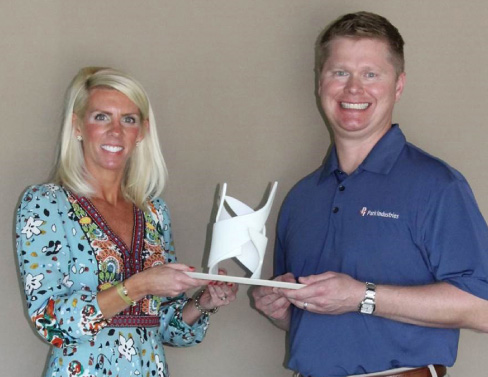 Mike Schlough of Park Industries® accepts the 2018  Envision award from ISFA Executive Director Amy Miller at the ISFA conference in Cancun, Mexico.