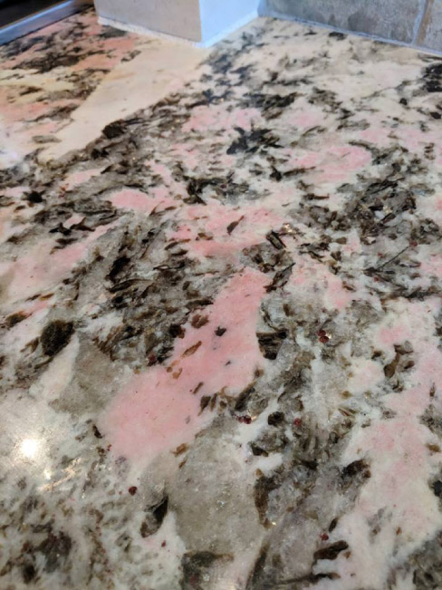 No, the pink coloration in the granite is not due to some odd reaction to resin, glues or some impregnating sealer. Take another guess…