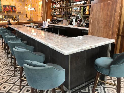 Luminesce quartzite bar top, installed in the Hyde Park, Chicago location of the five-star Sophy Hotel 