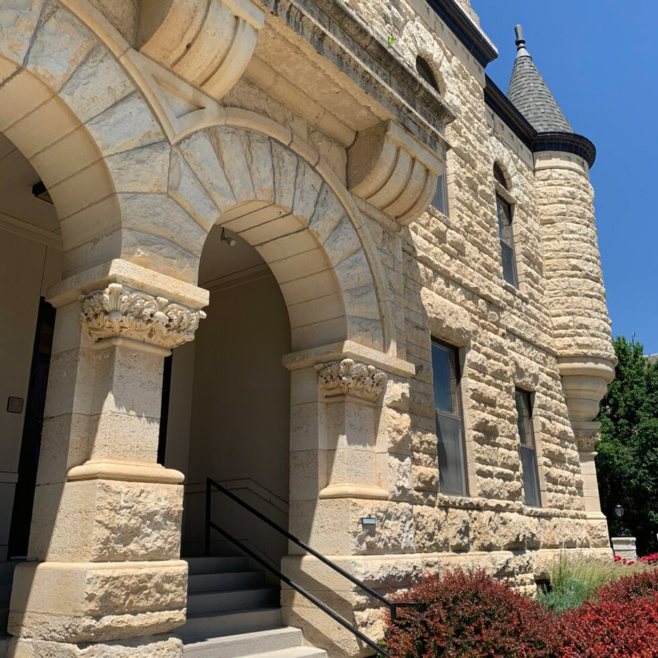  Manglitz assessed sixty stone buildings on the Kansas State University campus in the summer of 2019. The buildings ranged in age from 20 to 143 years old; the study identified life-safety and water infiltration issues to help the University prioritize and plan façade repairs. Holton Hall (pictured here) was constructed in 1900 using Kansas Cottonwood and Junction City limestones.