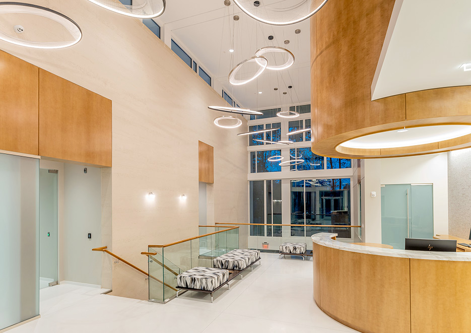 Offices of Preston Development. This large-scale project involved exterior cladding and interior design elements, including wall cladding, and a curved reception desk in the lobby, other stone accents.