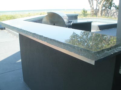 This intricate countertop was designed to make use of the customer’s tile and resourcefully uses recycled windshields