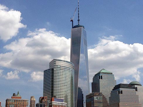 One World Trade Center. Inset: One of five identical cornerstones made from black granite, white marble and stainless steel. The blocks are 2˝ thick, waterjet cut, with a single intricate stainless steel graphic inlay.