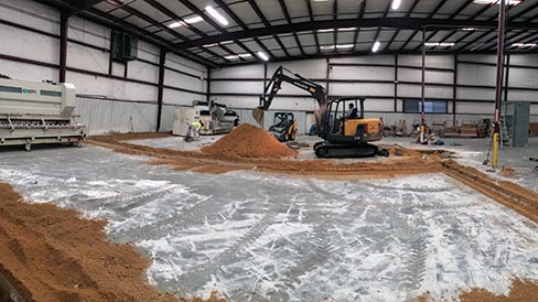 Rockcrete engineers excavate the trenches and collection pits for a granite cutting and line polishing area.