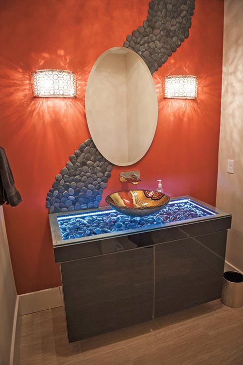 Hidden Creek, a small custom cabinet shop located in Ohio, supplied this unique black acrylic vanity. The onyx vessel sink was the client’s choice, from an unknown source.