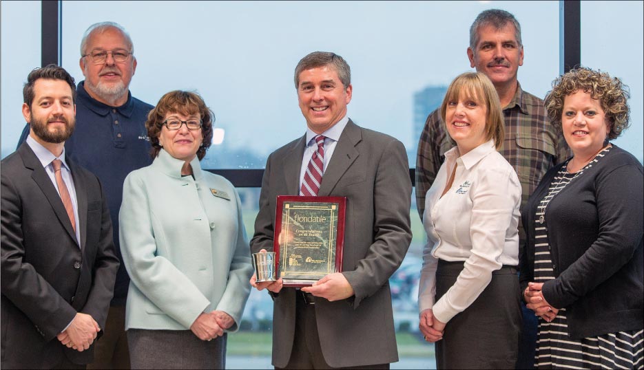 Mountain Re-Source Center and its partners honored Florida Tile for ten years of partnership at the company’s headquarters in Lexington, Kentucky, on December 4, 2014. L to R: Sean Cilona of Florida Tile, Herb Miller of Mountain Re-Source Center, Kentucky Sixth Congressional District Director Diane Hancock, Michael Franceschelli of Florida Tile, Ally Venugopal of Mountain Re-Source Center, Ashley Napier of Central West Virginia Outreach Center, and Lisa Boen of Operation Compassion.