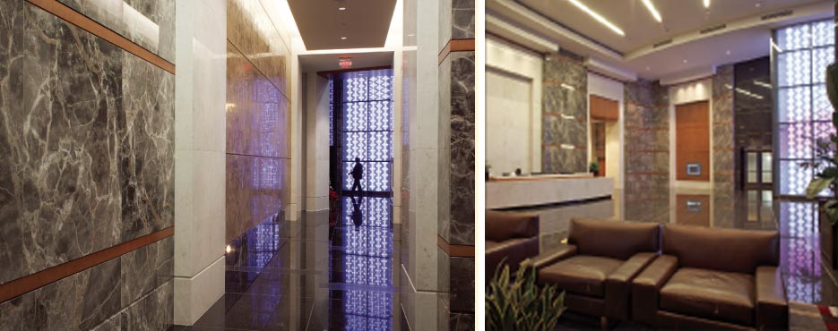 Lobby and elevator vestibule  at 1075 Peachtree Office Building in Atlanta, Georgia, features Fior di Bosco marble wall cladding and French Vanilla dimensional marble walls.