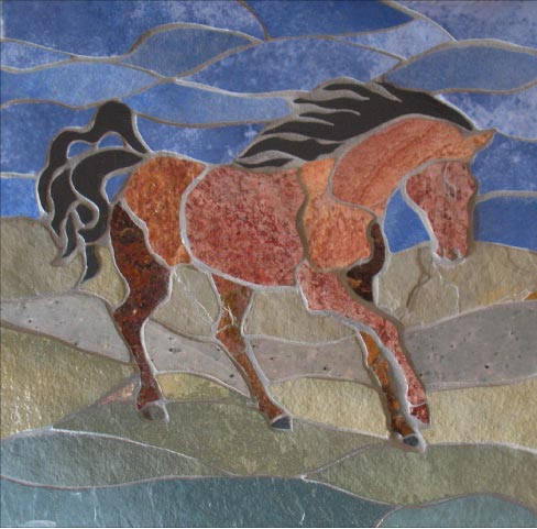 A Horse For Terry is 16  by 18 inches, assembled from complementary shades of slates and blue ceramic. This detail shows how Tholberg uses subtle textures and colors in her work.