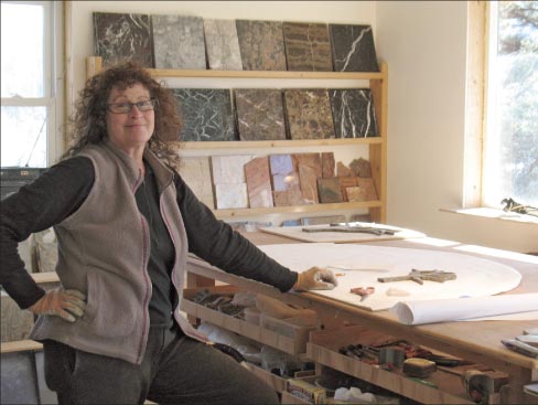 Emily Tholberg at the beginning of her commissioned project Elk and Eagle Near Navajo Peak. “I didn’t know I was going to do so much landscape,” said Tholberg, “but people around here are really excited about having elk and mountains in their homes.”