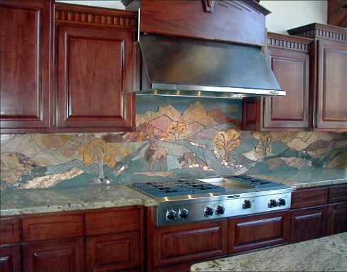 Elkville is a full-height, 19-foot-long backsplash mural made out of travertine, marble, slate, porcelain, sandstone and pebbles. Installed in a private residence in Pagosa Springs Colorado.