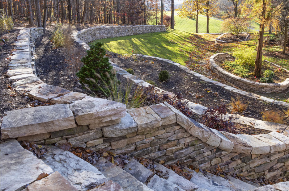 This traditional dry laid wall project includes a running wall, terraces and stairs.  According to Peachy, it took 30 dump truck loads of stone. 