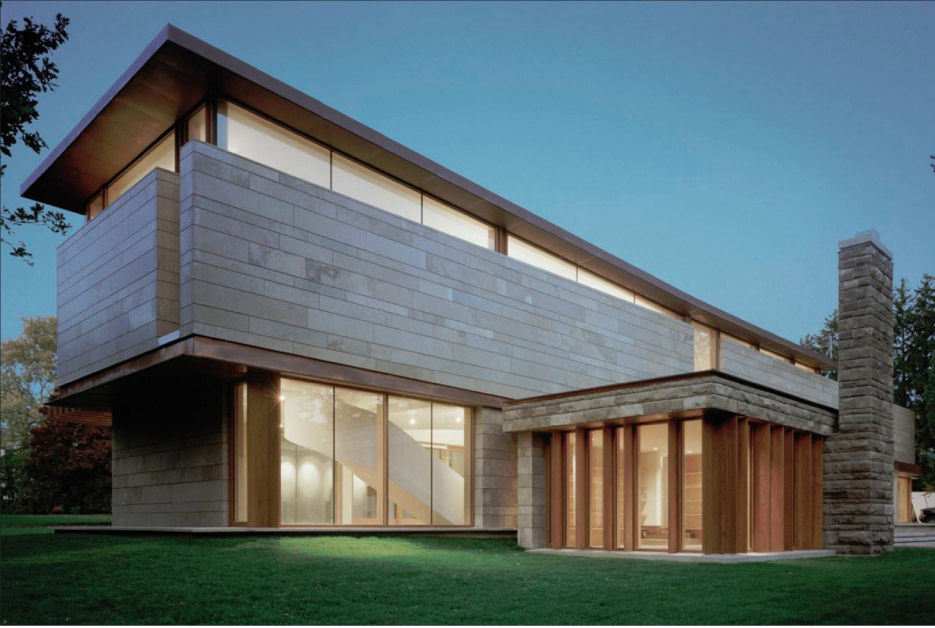 Honed Algonquin Fleuri limestone panels clad this sleek modern residence in Ontario.