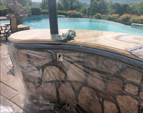 48-inch Tape & Drape was applied to cover the island cabinets for protection while refinishing this onyx countertop.