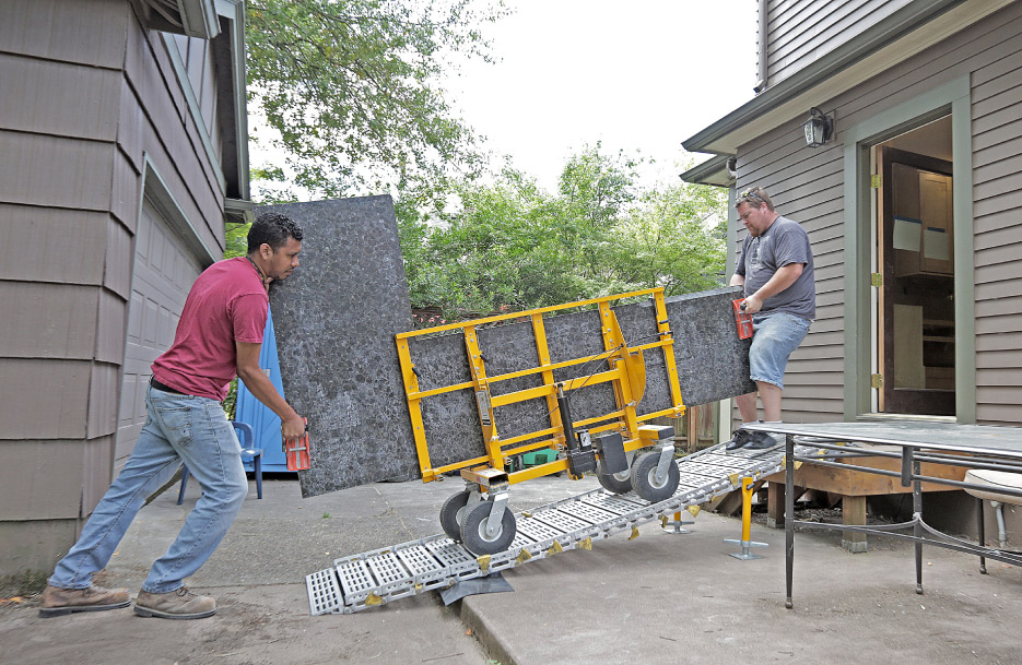 The aluminum folding Roll-A-Ramp accessory is rated for 900 pounds, with optional extensions to provide safe countertop delivery to jobsites with access challenges like stairs. Alan Ramirez and Sean Crews, installers for Crowley’s Granite Concepts, have been using the No-Lift for years, with a noticeable reduction of strain.