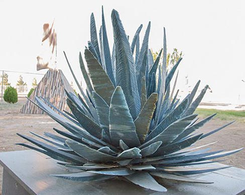 Shown here is “Lazuline,” a delicate 60 inch high x 60 inch wide x 60 inch deep sculpture carved in 2009 from Brazilian Blue quartzite. Eino considers this to be one of his masterpieces because of the thinness of the stone, the surface texture of each blade (on both sides), the hardness of the stone, and the engineering required not only to assemble the piece, but to make it able to be relocated without breaking.