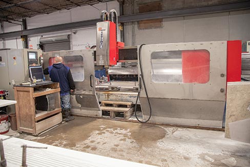 A Glassos® Crystal White chair rail is being milled on the Ravelli Teorema 4-axis CNC by technician Felix McElroy. Felix is a thirteen-year veteran, and going strong, employee. “Part of the business I find interesting is duplicating profiles, color and thickness matches for historic renovations,” explained Jonathan Mitnick. “We do that—we like to do that. It’s time consuming and I wonder sometimes if it’s taking time away from our business, and is it profitable. I geared up to do production, and I’m doing this? But I think that is part of what makes you important to your customer. You’re now a go-to guy and you’re at the top of someone’s speed dial.”