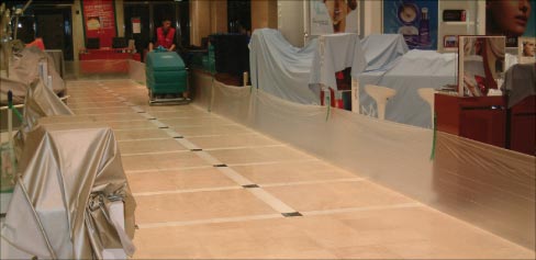 Using a walk-behind auto-scrubber with polishing compound keeps the flooring in this large retail space looking its best.