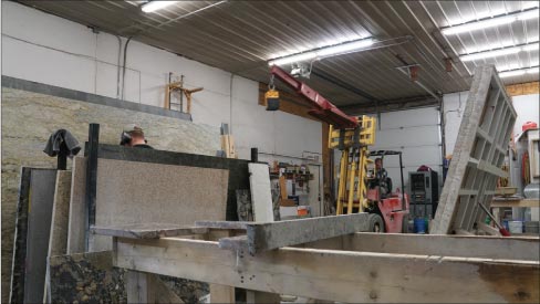 Matt Hoffmeyer pilots their forklift to move in the next slab. “The two men in our shop have been doing fabrication a long time and are really good at it,” said Matt Hoffmeyer. Mammoth Granite’s fab-shop is fully wet — safety is of primary concern.