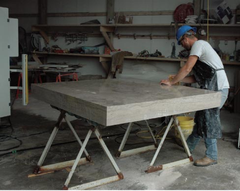 A Phenix Marble shop fabricator puts the last touches on one of the landing stones destined for Phase 1 renovations at the Missouri State Capitol building. The landing stones are 61 x 62 x 6.5 inches and weigh 2,325 lbs. each. Stone from the Phenix Quarry was used throughout the  Capitol building interior was it was built in 1917.