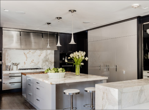 United Marble Fabricators was awarded the 2016 Kitchen of the Year for this project. One focal point of the room is this beautiful, flowing expanse of marble backsplash.