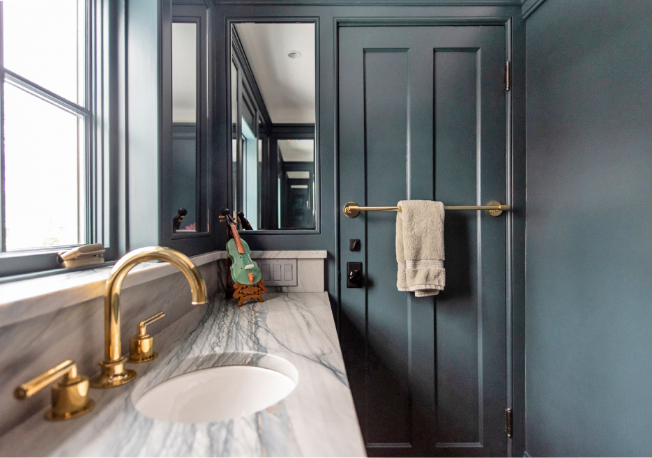 This powder room features Soleil quartzite.  Photo courtesy Shumaker Design & Build Associates