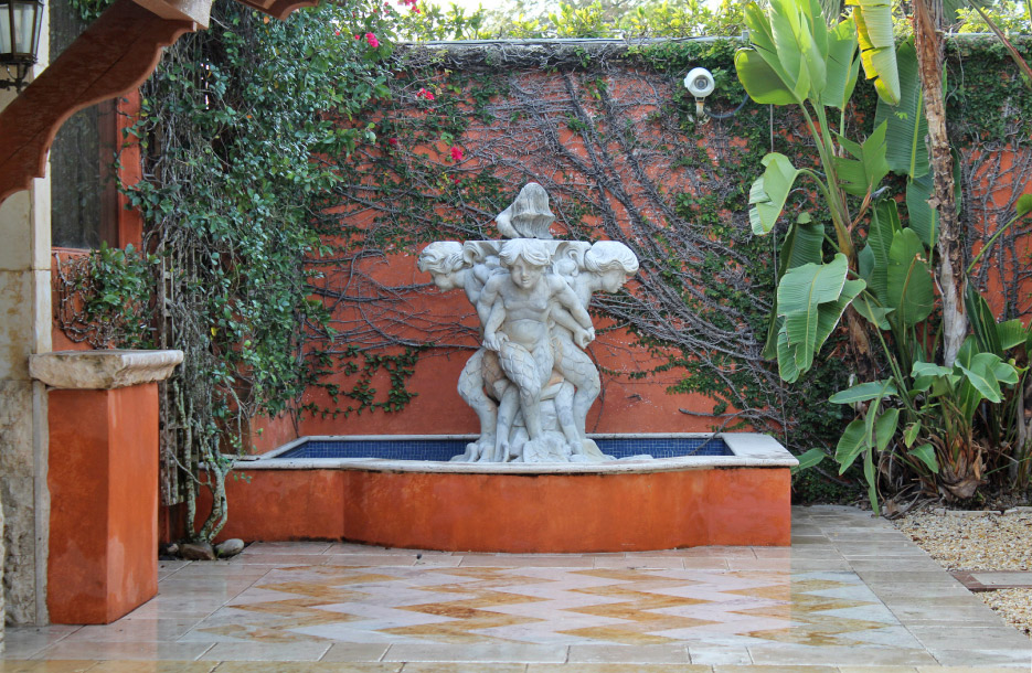 A 200-year- old fountain carved in the round from Carrara marble graces the exterior courtyard of their showroom.