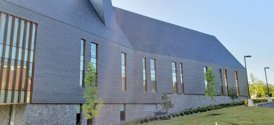 The natural slate cladding allows the building to breathe.