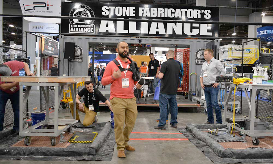 Andrew Geronimo of BB Industries demos the Swiss Air Respirator at the SFA booth