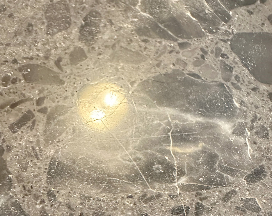 Engineered marble. Note the minor surface scratches.