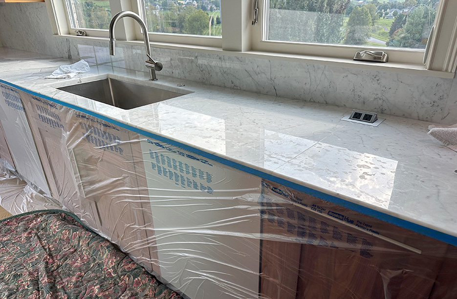 Marble countertop with etching all over the surface.