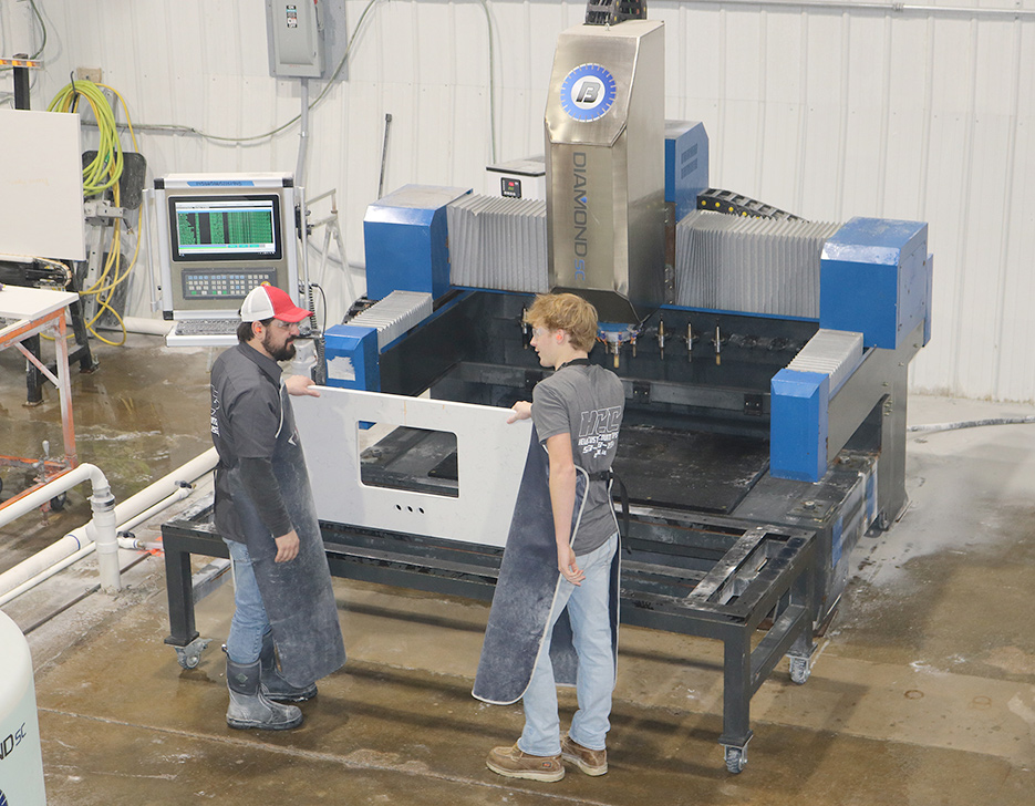 Isaiah MacDonald preps a sink cutout.