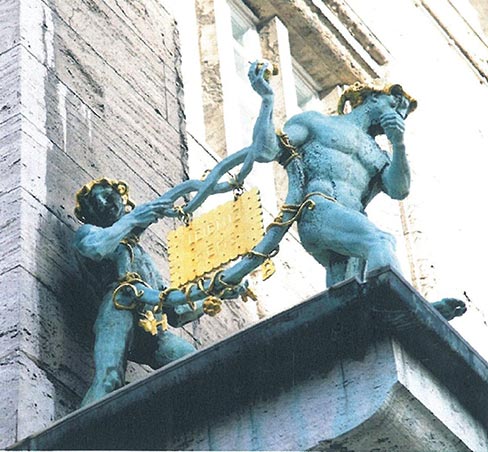 NOW YOU SEE IT...The combo photo released by Police in Hannover, northern Germany, Tuesday, Jan. 29, 2013 shows a statue gracing the façade of German cookie baker Bahlsen’s Hannover office before and after the rectangular gilded bronze sculpture was taken away.