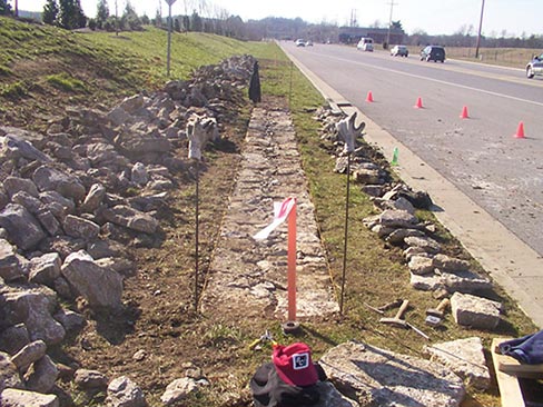 The Hillsboro Road reconstruction project in Tennessee involved rebuilding more than 1,000 linear feet of historic stone wall that was destroyed a few years ago when the roadway was widened. The original stone was salvaged by local preservation-minded people and stored at a county facility while funding was secured for it to be rebuilt. All the historic stone was used in the new wall . . . along with some new stone for structural improvements (foundations, ties and covers) that were missing from the original wall design. Williamson County is the project sponsor, with 80% of the funding provided by the Tennessee Department of Transportation