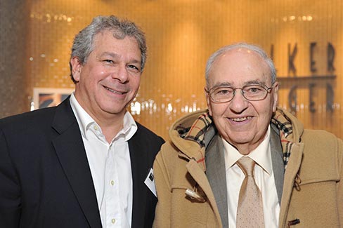 Jonathan Zanger and his father, Leon, in front of the Walker Zanger company logo that has become synonymous with quality architectural stonework.