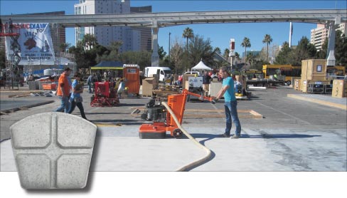 The WerkMaster™ crew polished a four-day-old concrete slab to a 1,500 grit mechanical finish without using sealers. The entire project, including the edging, was done using a WerkMaster™ Propane Colossos XT, shown here in action. Inset: New Achromic Plug-N-Go resin tooling from WerkMaster™ will not transfer color to concrete.