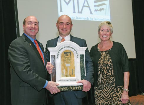 Stefano Follega (Center) accepts the 2014 Craftsman of the Year Award from MIA President Tony Malisani and program sponsor Brenda Edwards of TexaStone Quarries. Not pictured is program sponsor Patrick Perus of Polycor.