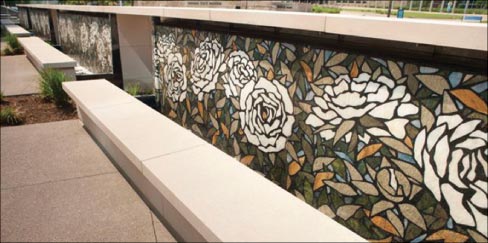 Flower pattern terrazzo waterwall at the J.W. Marriott plaza in downtown Indianapolis, fabricated from natural stone slab pieces. Cut on Santarossa’s water jet machine,  the pieces were mounted into a black, cement-based terrazzo, the design installed on site by their craftsmen.