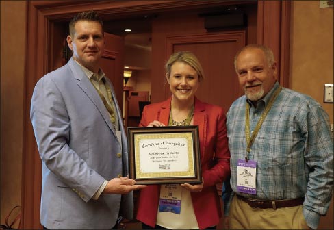 Shea Quarton and John Striednig (center and right) accept the 2016 Educator of the Year Award from MIA+BSI Education Committee Chair, Rob Bacon (Daltile). 