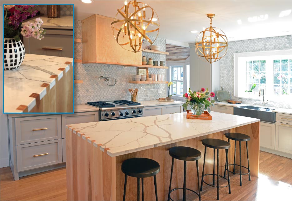 This kitchen has a smooth box joint countertop with wood & Daltile Calacatta quartz.