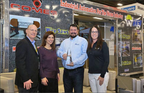 Matt Wilson and Melisa Black (center and right) accept the Best Large Booth Award at TISE 2018, sponsored by Stone World magazine and Tile magazine.